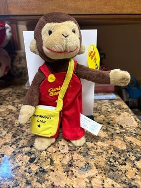 Curious George Plush Monkey in Brown with Red Overalls and Yellow Bag